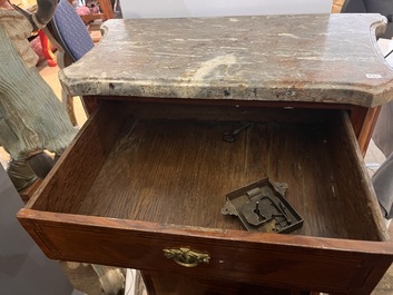 A pair of French Louis XVI style single door hall cabinets with floral marquetry, gilt bronze mounts and marble tops, 19th C.