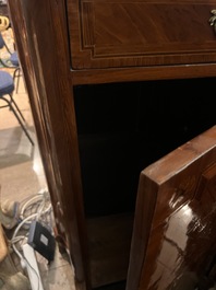 A pair of French Louis XVI style single door hall cabinets with floral marquetry, gilt bronze mounts and marble tops, 19th C.
