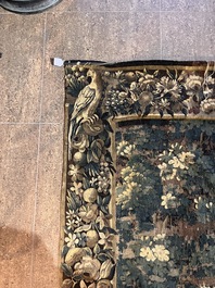 A Flemish verdure wall tapestry with two swans in a lake, probably Oudenaarde, late 17th C.