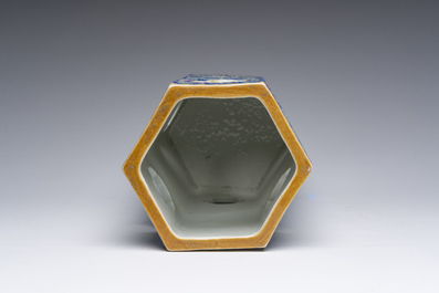 A Chinese reticulated hexagonal blue ground famille rose hatstand, 19th C.