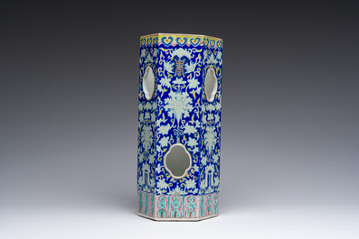 A Chinese reticulated hexagonal blue ground famille rose hatstand, 19th C.