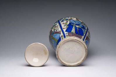 A large Persian pottery vase and cover with figurative design, 20th C.