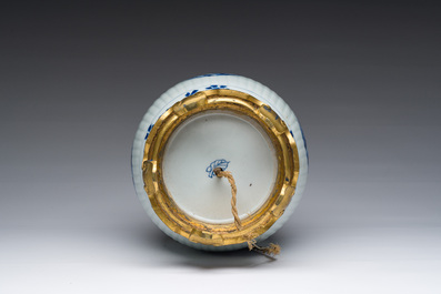 A Chinese blue and white vase with floral design with gilt bronze mounts mounted as a lamp, Kangxi