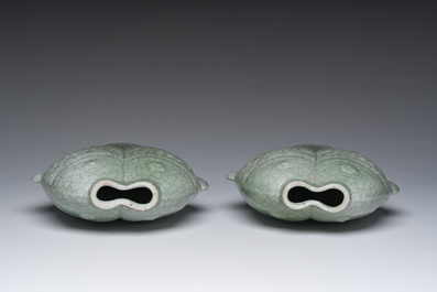 A pair of Chinese celadon glazed 'twin fish' vases, 19th/20th C.