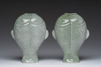 A pair of Chinese celadon glazed 'twin fish' vases, 19th/20th C.