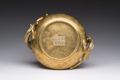 A Chinese bronze censer with relief design, Xuande mark, 19th/20th C.