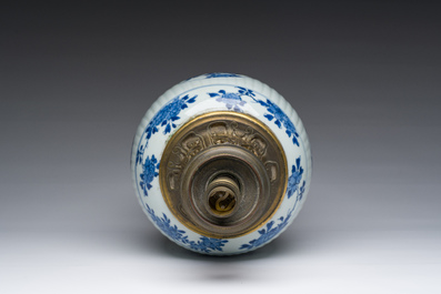 A Chinese blue and white vase with floral design with gilt bronze mounts mounted as a lamp, Kangxi