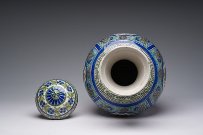 A large Persian pottery vase and cover with figurative design, 20th C.