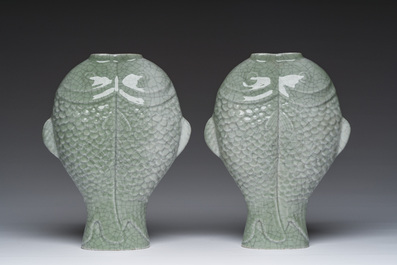 A pair of Chinese celadon glazed 'twin fish' vases, 19th/20th C.