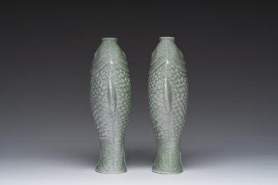 A pair of Chinese celadon glazed 'twin fish' vases, 19th/20th C.