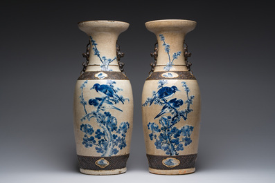 A pair of Chinese Nanking crackle glazed blue and white vases with Buddhist lions and birds among blossoming branches, 19th C.