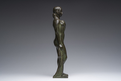 Andr&eacute; Taeckens (1906-1965): Femme nue debout portant un collier, bronze patin&eacute;, marque de fonderie 'Brons G. Vindevogel'