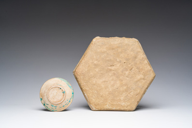 A hexagonal turquoise glazed Islamic tile and a calligraphic saucer, probably Damascus, Syria, 17th C.