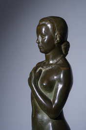 Andr&eacute; Taeckens (1906-1965): Femme nue debout portant un collier, bronze patin&eacute;, marque de fonderie 'Brons G. Vindevogel'