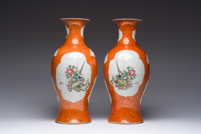 A pair of Chinese famille rose coral red-ground vases, Qianlong mark, Republic, 20th C.
