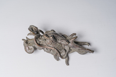 A Japanese three-piece bronze garniture with dragon relief design, Meiji, 19th C.