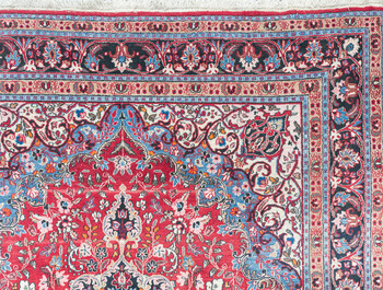 A Persian Mashad rug with floral design, wool on cotton, 20th C.