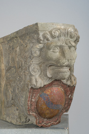A pair of partly polychromed stone beam supports in the shape of lions holding coats of arms, probably Flanders, 16th/17th C.