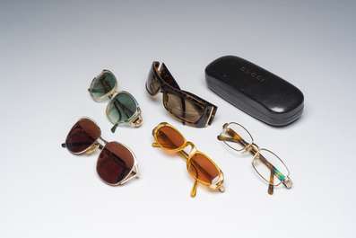 Four various sunglasses and a pair of reading glasses, Bulgari, Christian Dior, Gucci and Yves Saint Laurent, 20th C.