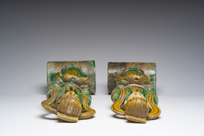 A pair of Chinese sancai roof tiles, a pair of famille rose plates and a pair of Imari style plates, Ming and later