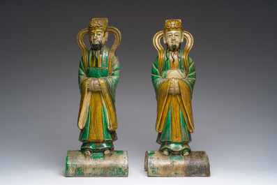 A pair of Chinese sancai roof tiles, a pair of famille rose plates and a pair of Imari style plates, Ming and later