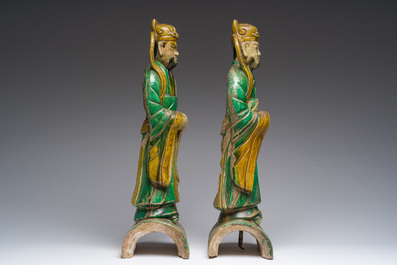 A pair of Chinese sancai roof tiles, a pair of famille rose plates and a pair of Imari style plates, Ming and later