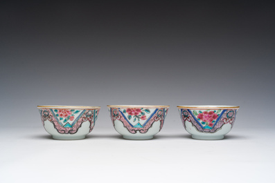 Three Chinese famille rose cups and saucers with floral design, Qianlong