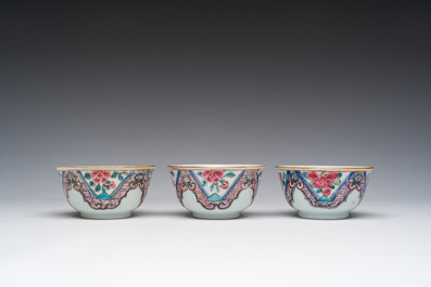 Three Chinese famille rose cups and saucers with floral design, Qianlong