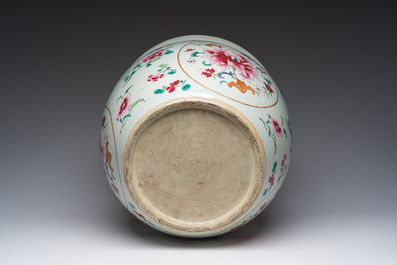 A Chinese famille rose jardini&egrave;re with floral design on a wooden base, 19th C.