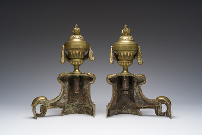A pair of French Louis XVI style gilt bronze andirons with lion heads and garlands, ca. 1900