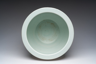 A Chinese famille rose jardini&egrave;re with floral design on a wooden base, 19th C.