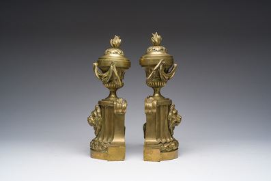 A pair of French Louis XVI style gilt bronze andirons with lion heads and garlands, ca. 1900