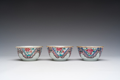 Three Chinese famille rose cups and saucers with floral design, Qianlong