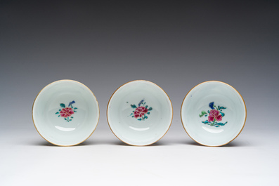 Three Chinese famille rose cups and saucers with floral design, Qianlong