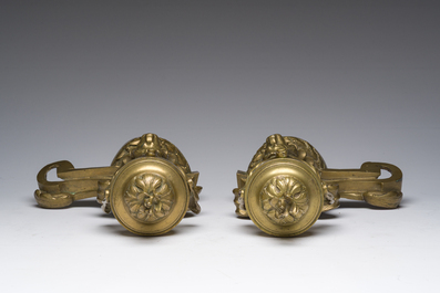 A pair of French Louis XVI style gilt bronze andirons with lion heads and garlands, ca. 1900