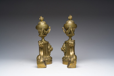 A pair of French Louis XVI style gilt bronze andirons with lion heads and garlands, ca. 1900