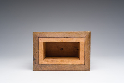 An Italian walnut sculpture of a youth kneeling on a cushion with floral design, 19th C.