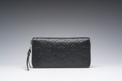 A black leather Louis Vuitton 'Cl&eacute;mence Wallet' with the original packaging, 21st C.
