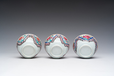 Three Chinese famille rose cups and saucers with floral design, Qianlong