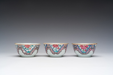 Three Chinese famille rose cups and saucers with floral design, Qianlong