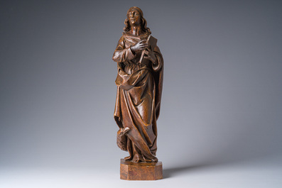 A Flemish patinated wooden 'John of Patmos' sculpture, ca. 1800
