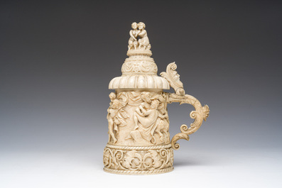 A German ivory mug and cover or tankard with relief design of 'Bacchanalia' scenes and satyrs, ca. 1880