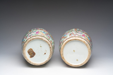 A pair of Chinese Canton famille rose vases with palace scenes and floral design, 19th C.