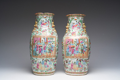 A pair of Chinese Canton famille rose vases with palace scenes and floral design, 19th C.