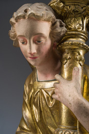 An impressive pair of polychrome decorated plaster angels mounted into ten-light candlesticks, 20th C.