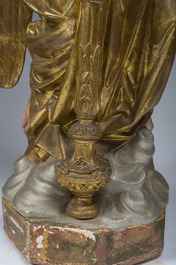 An impressive pair of polychrome decorated plaster angels mounted into ten-light candlesticks, 20th C.