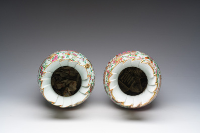 A pair of Chinese Canton famille rose vases with palace scenes and floral design, 19th C.