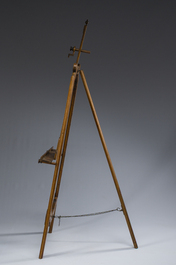 A carved walnut painter's easel with brass mounts, early 20th C.