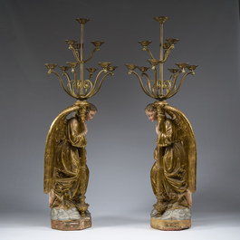 An impressive pair of polychrome decorated plaster angels mounted into ten-light candlesticks, 20th C.