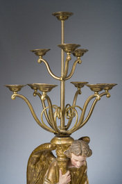 An impressive pair of polychrome decorated plaster angels mounted into ten-light candlesticks, 20th C.